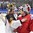 PLYMOUTH, MICHIGAN - April 3: Germany's Jennifer Harss #30 congratulates Switzerland's Florence Schelling #41 after the game during preliminary round action at the 2017 IIHF Ice Hockey Women's World Championship. (Photo by Minas Panagiotakis/HHOF-IIHF Images)